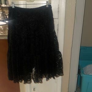 Size 2, pre-owned, in excellent condition with no tears or damage.